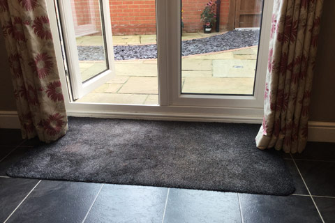 Wellington boots on door mat